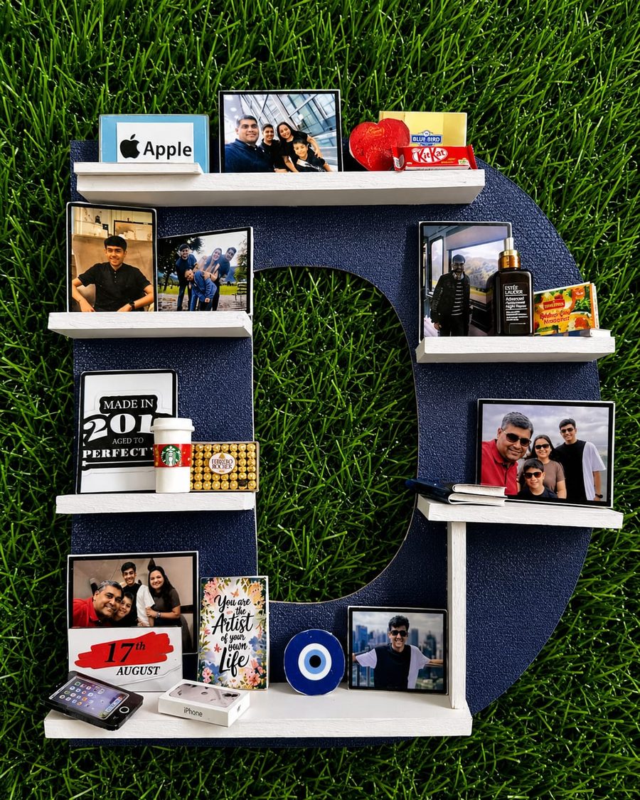 A letter-shaped Memory Wall holding photographs and small keepsakes.
