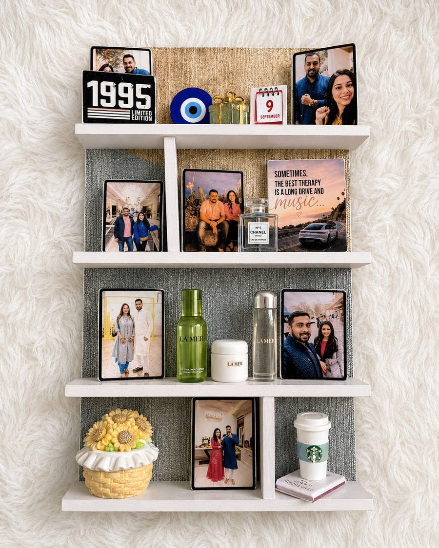 A rectangular shelf Memory Wall holding couple photographs, a date and small keepsakes.