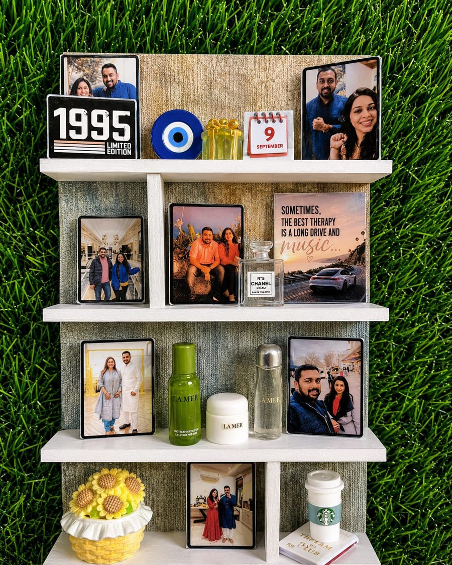 The same shelf Memory Wall photographed against grass, showing the full arrangement.